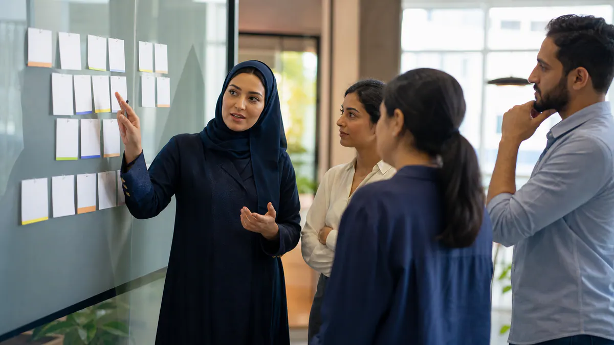 Arab women in a professional meeting and an interactive workshop